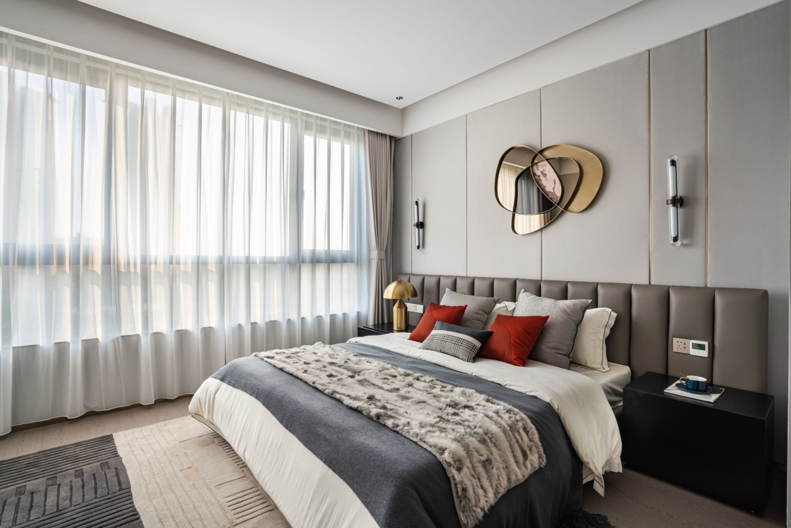 Grey bedroom with upholstered bed